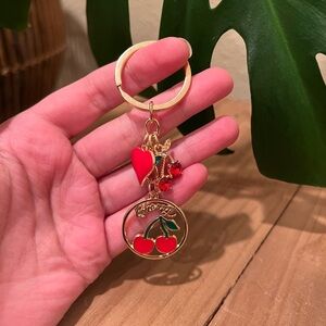 Gold Cherry Charm Keychain with Red Accents
